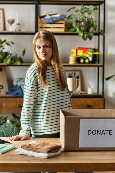 Brightly lit room where a young woman sorts clothes for donation, promoting sustainability.