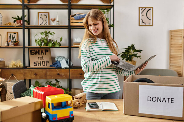 Pretty young woman sorts through clothes to donate, embracing a sustainable lifestyle approach.