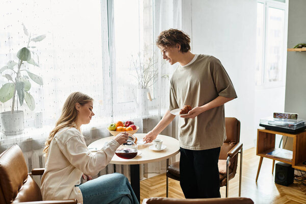 A young couple shares a delightful breakfast at home, savoring warm moments and tasty treats.