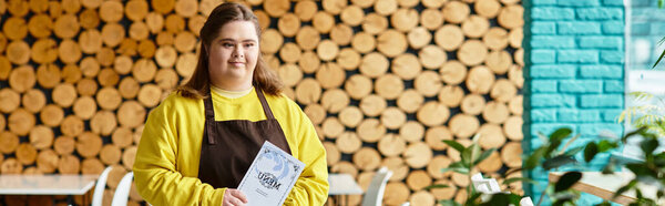Young woman radiates confidence while presenting a menu in a lively, welcoming cafe atmosphere.