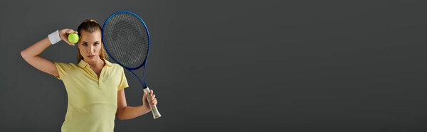 A young, talented woman prepares to serve during an energetic tennis match, banner