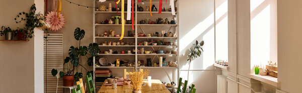 Colorful pottery studio filled with vibrant materials and art in soft midday light.