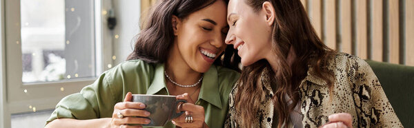 Bright smiles light up the cafe as the couple enjoys their coffee together, embracing in joy.