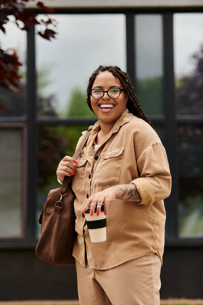 Educator interacts cheerfully with students, holding a coffee cup and smiling warmly.