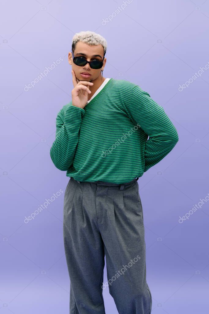 A confident young Black man poses stylishly with dyed hair and a trendy outfit.