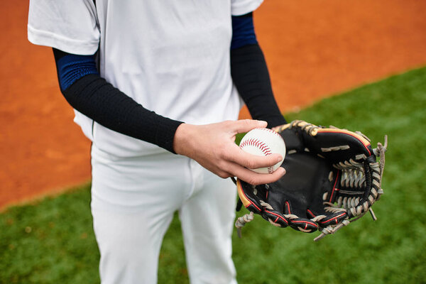 A young athlete prepares to pitch the ball, showcasing determination and skill on the field.