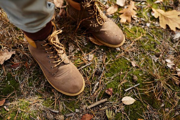 Senior woman takes a leisurely hike, surrounded by vibrant autumn leaves and natures tranquility.