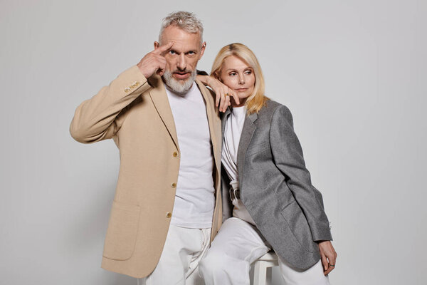 A loving senior couple shows their style, radiating warmth and connection in theirPose.