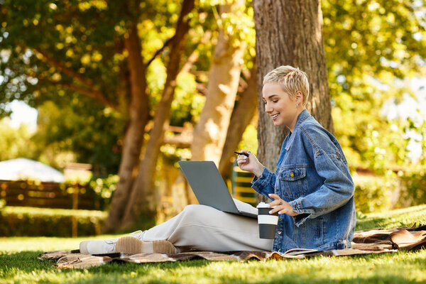 A beautiful young woman with short hair takes a stroll through a lush green park, savoring nature.