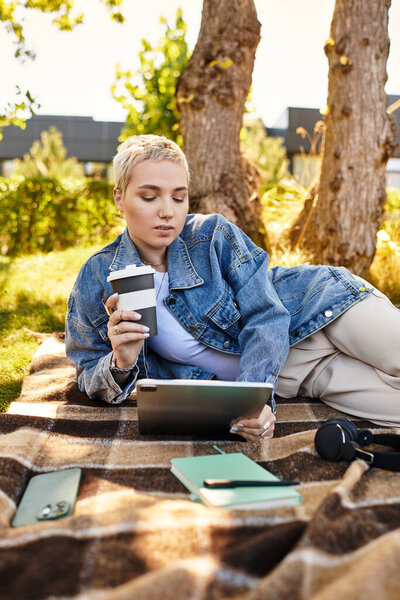 Young woman takes a stroll outdoors, her short hair catching the sunlight, savoring the moment.