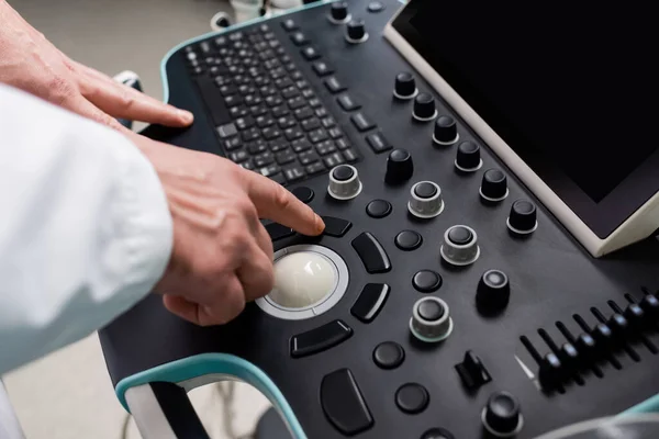 Partial view of physician using control panel of ultrasound machine — Stock Photo