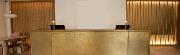 Computer monitors at luxury reception desk in hotel, banner — Stock Photo
