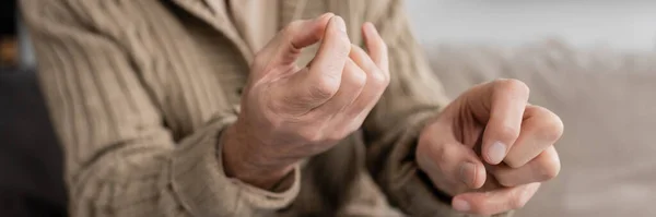 Trembling hands of cropped man with parkinson disease, banner — Fotografia de Stock