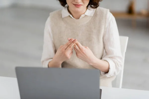 Partial view of smiling teacher showing British two handed sign alphabet during online lesson — Stock Photo