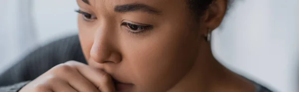 Frustrated multiracial woman with psychological problem looking away at home, banner — Stock Photo