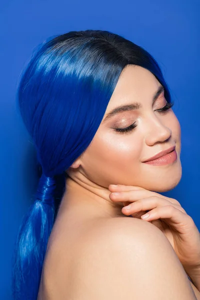 Glowing skin concept, portrait of young woman with vibrant hair color posing with bare shoulders on blue background, youth, individualism, beauty trends, unique identity, closed eyes — Stock Photo
