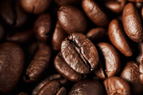 Close up, black coffee beans in wooden box, dark roast, caffeine and energy, coffee background — Stock Photo
