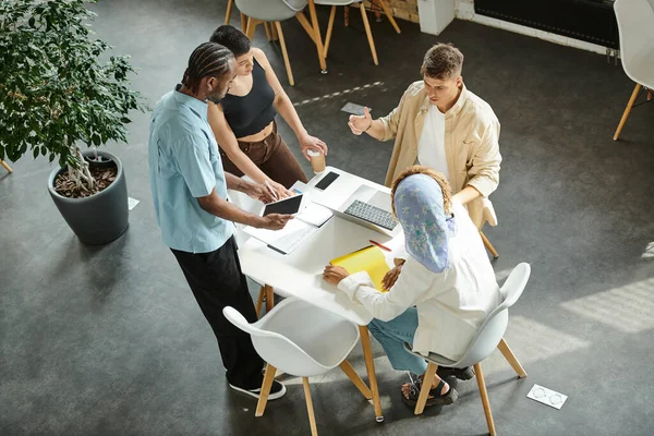 Coworking, interracial business people discussing startup project in open space, generation z, work — Stock Photo