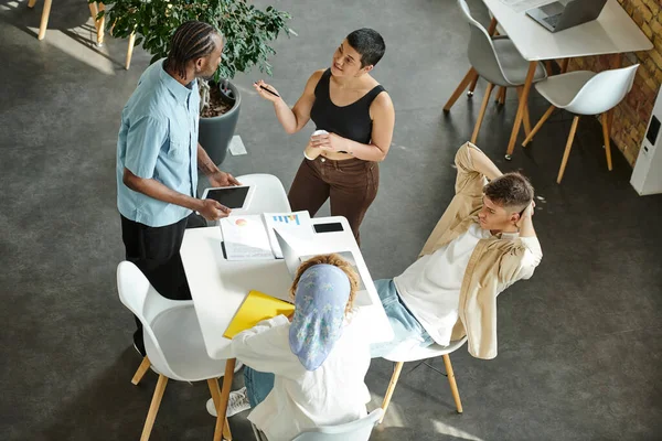 Coworking, open space, multicultural business partners discussing startup project, generation z — Stock Photo