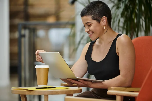 Tattoo: no sugar, cheerful woman using laptop, video call, working on startup project, coworking — Stock Photo