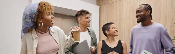 Cultural diversity, positive interracial men and women walking together in modern coworking, banner — Stock Photo