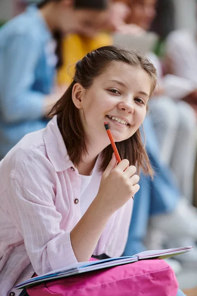 Back to school, happy and smart girl holding pencil and looking at camera, study, ideas, learn — Stock Photo