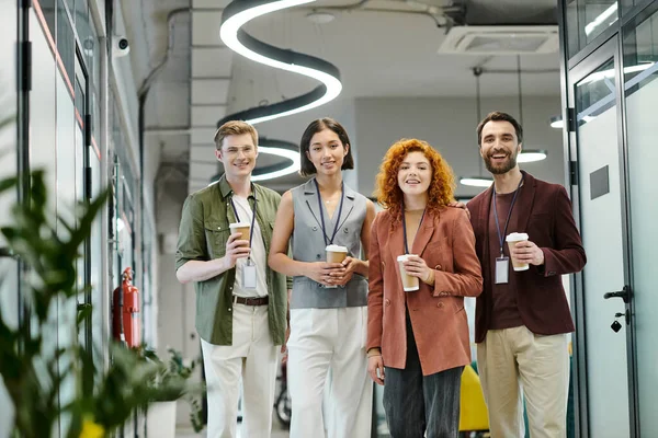 Pleased business colleagues with paper cups looking at camera in office, professional headshot — Stock Photo