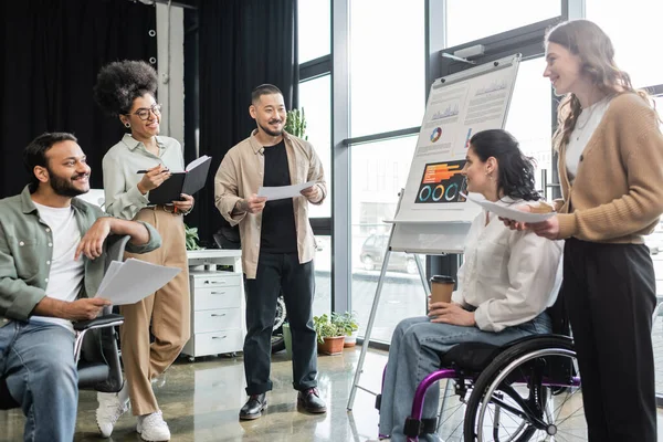 Inclusion concept, woman in wheelchair working together in interracial business people in office — Stock Photo
