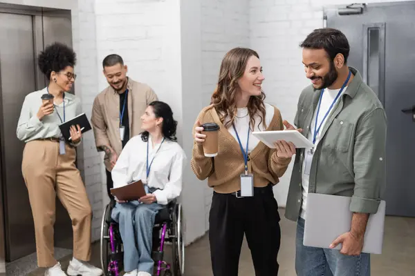 Inclusion and diversity, happy multiethnic team standing together near office elevators in hall — Stock Photo