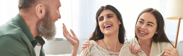 Father talking actively to his cheerful  pregnant daughter and her partner, ivf concept, banner — Stock Photo