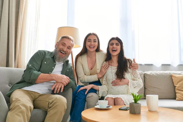 Joyful father visiting his pregnant lesbian daughter, smiling sincerely at camera, ivf concept — Stock Photo