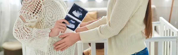 Cropped view of lgbt couple with hands on belly and ultrasound of their baby, ivf concept, banner — Stock Photo