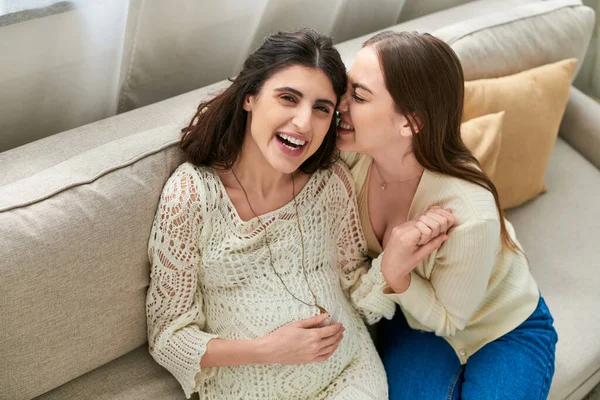 Happy lesbian couple holding hands and hugging warmly, nose to cheek, in vitro fertilisation concept — Stock Photo