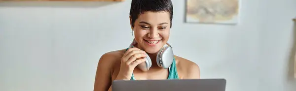 Cheerful woman attending online fitness lesson smiling at camera, fitness and sport, banner — Stock Photo