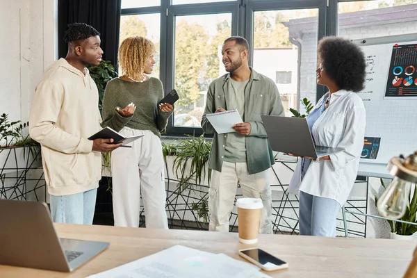 Good looking team of african american friends working on their project together, business concept — Stock Photo