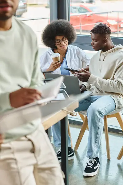 Cropped view of young man with notes with his friends working on backdrop, business concept — Stock Photo