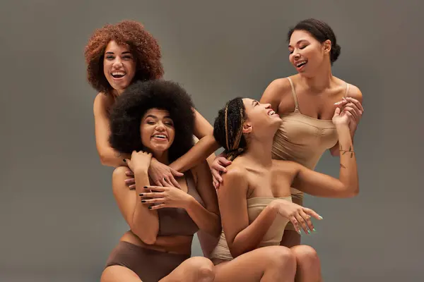 Appealing happy african american women in comfy underwear having great time together, fashion — Stock Photo