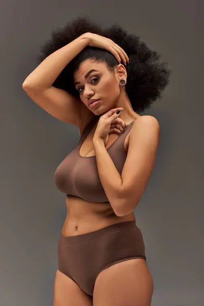 Young african american woman in pastel underwear with black nail polish posing alluringly, fashion — Stock Photo