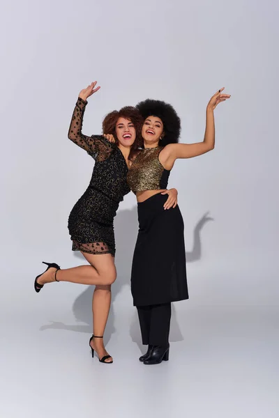 Two beautiful african american female friend spending time together partying actively, fashion — Stock Photo