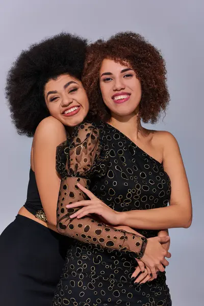 Two pretty happy african american women in festive attires partying together, fashion concept — Stock Photo