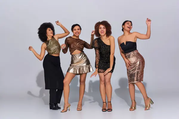 Four attractive african american woman in party outfits spending time together, fashion concept — Stock Photo