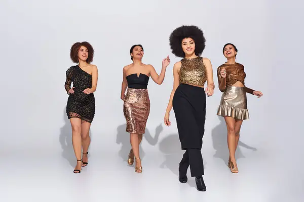 Four attractive african american woman in party outfits spending time together, fashion concept — Stock Photo