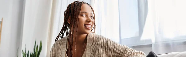 Joyous attractive african american woman in homewear with braces posing and looking away, banner — Stock Photo
