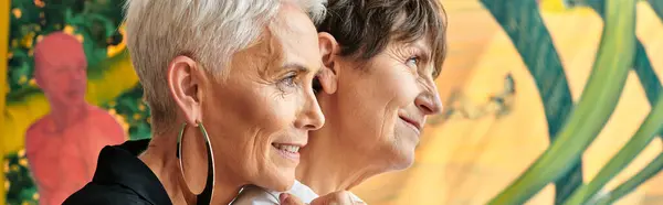 Side view of mature happy lesbian artists looking away in contemporary art workshop, banner — Stock Photo
