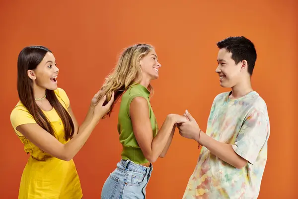 Joyous multicultural adolescent friends having great time together and looking at each other — Stock Photo