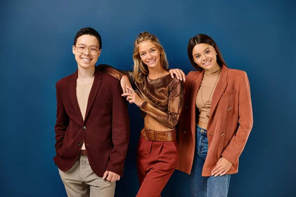 Joyous multiracial teenagers in fashionable attire posing and smiling at camera, friendship day — Stock Photo