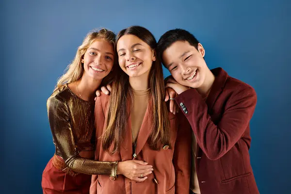 Cheerful diverse adolescents in elegant outfits posing together and smiling happily, friendship day — Stock Photo