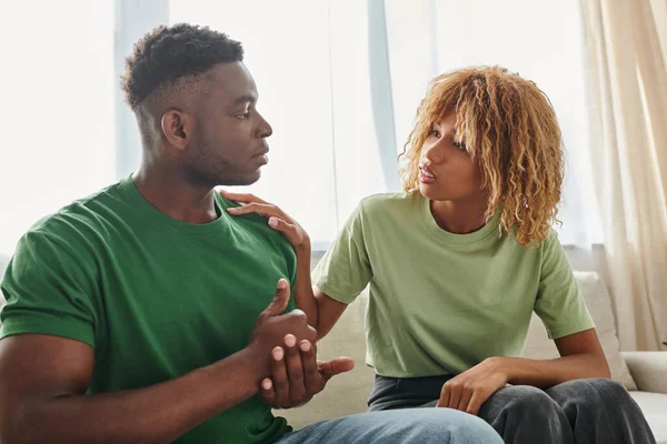 Black man showing help gesture while communicating with worried girlfriend and using sign language — Stock Photo