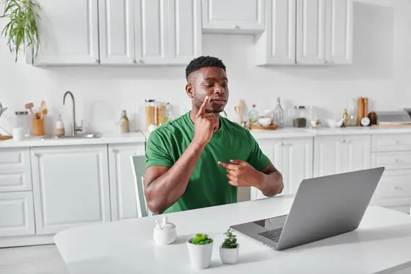 Deaf african american freelancer using sign language for communication during video call — Stock Photo