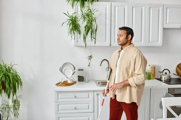 Handsome blind indian man in casual cozy homewear using walking stick while at home, disabled — Stock Photo